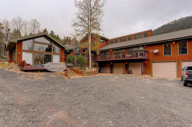 2720 S Spring Gulch Rd, Idaho Springs, CO 80452 - view of front of home featuring an attached garage and a deck