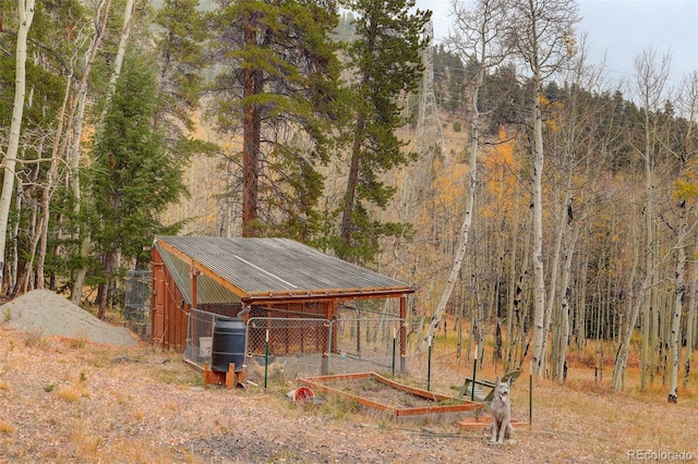 2720 S Spring Gulch Rd, Idaho Springs, CO 80452 - view of outdoor structure featuring a forest view
