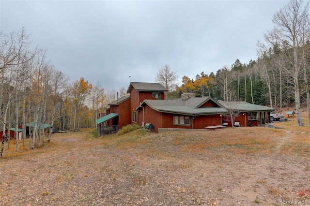2720 S Spring Gulch Rd, Idaho Springs, CO 80452 - view of home's exterior with a wooded view
