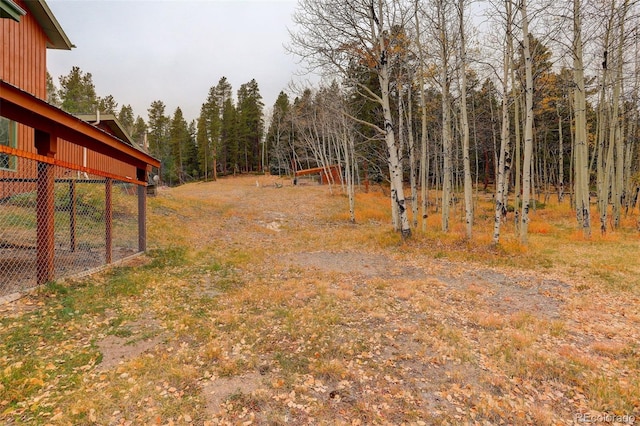 2720 S Spring Gulch Rd, Idaho Springs, CO 80452 - view of yard with a wooded view