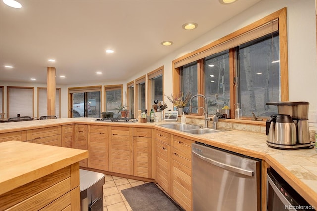 2720 S Spring Gulch Rd, Idaho Springs, CO 80452 - kitchen featuring stainless steel dishwasher, a sink, light brown cabinets, beverage cooler, and gas stovetop