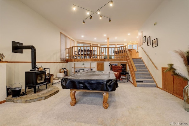 2720 S Spring Gulch Rd, Idaho Springs, CO 80452 - playroom featuring a wood stove, carpet, pool table, and baseboards