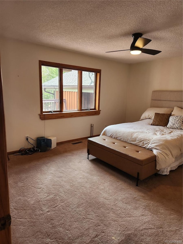 2720 S Spring Gulch Rd, Idaho Springs, CO 80452 - bedroom with carpet flooring, a textured ceiling, and a ceiling fan