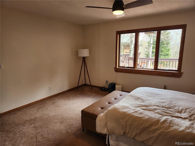 2720 S Spring Gulch Rd, Idaho Springs, CO 80452 - carpeted bedroom with baseboards, a textured ceiling, and a ceiling fan