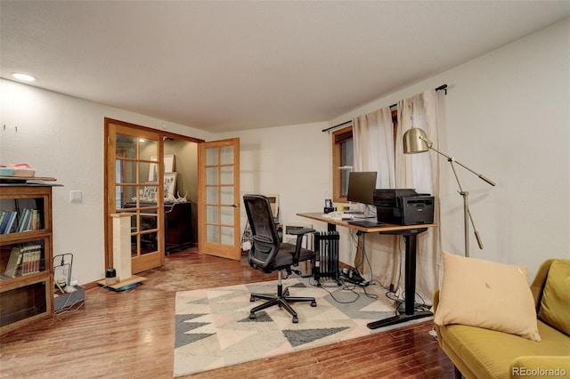 2720 S Spring Gulch Rd, Idaho Springs, CO 80452 - office space with french doors, wood finished floors, and baseboards