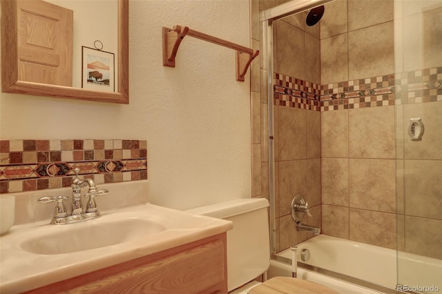 2720 S Spring Gulch Rd, Idaho Springs, CO 80452 - bathroom featuring toilet, enclosed tub / shower combo, and vanity