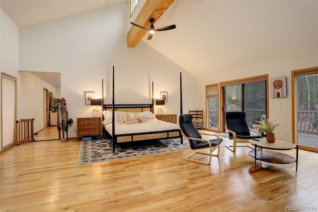 2720 S Spring Gulch Rd, Idaho Springs, CO 80452 - bedroom featuring high vaulted ceiling, light wood-type flooring, beam ceiling, access to outside, and baseboards