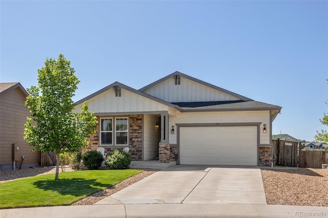 398 Midden Pl, Castle Rock, CO 80104 - view of front of property with driveway, an attached garage, board and batten siding, and stone siding