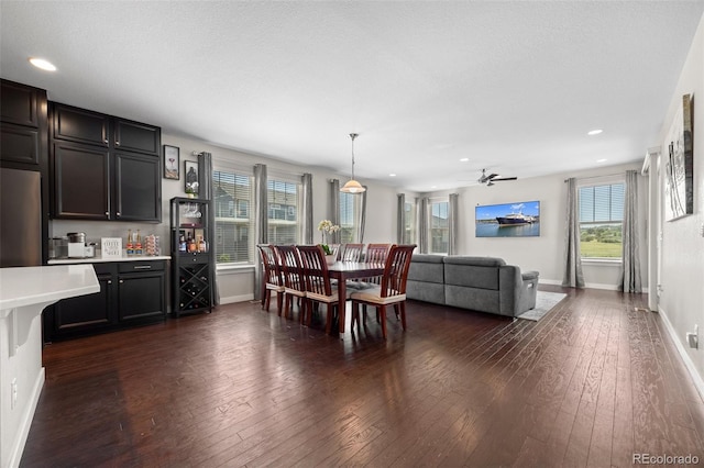 398 Midden Pl, Castle Rock, CO 80104 - dining space with wet bar, dark wood-style floors, healthy amount of natural light, recessed lighting, and ceiling fan