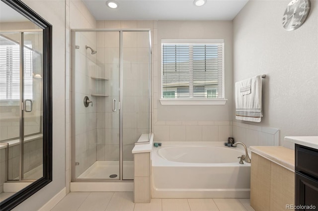 398 Midden Pl, Castle Rock, CO 80104 - full bathroom with tile patterned floors, a bath, vanity, a stall shower, and recessed lighting
