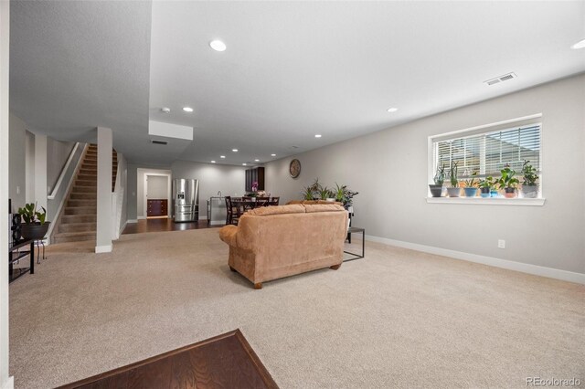 398 Midden Pl, Castle Rock, CO 80104 - living area with carpet floors, stairway, and recessed lighting