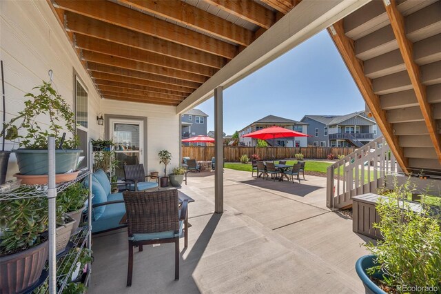 398 Midden Pl, Castle Rock, CO 80104 - fenced backyard featuring outdoor dining space, a patio, and a residential view