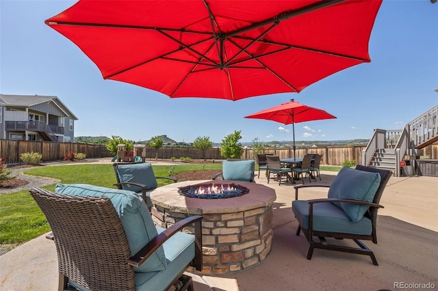 398 Midden Pl, Castle Rock, CO 80104 - fenced backyard featuring a fire pit, stairway, a patio area, a playground, and outdoor dining area
