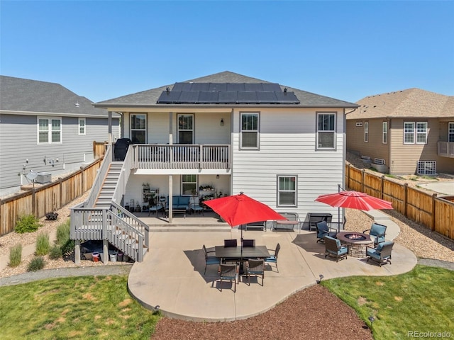 398 Midden Pl, Castle Rock, CO 80104 - rear view of property with stairs, solar panels, a fenced backyard, and a patio