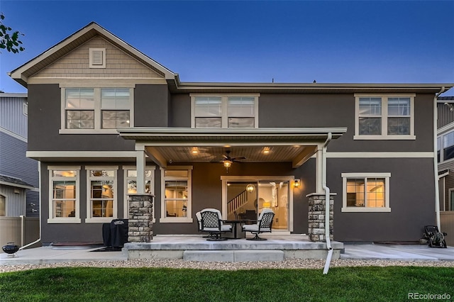 4965 Malaya St, Denver, CO 80249 - rear view of house featuring stucco siding, a patio area, and a ceiling fan