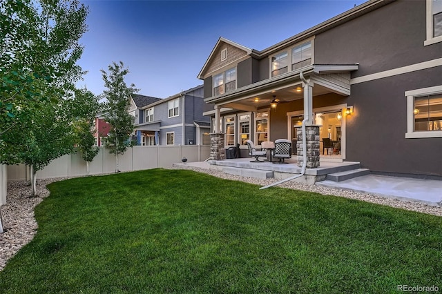 4965 Malaya St, Denver, CO 80249 - rear view of property with stucco siding and a patio area