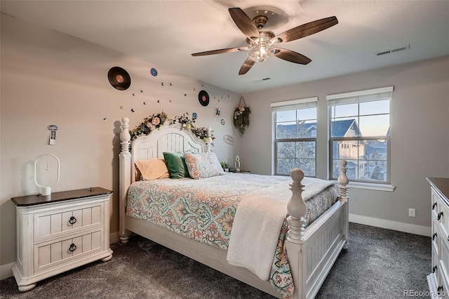 4965 Malaya St, Denver, CO 80249 - bedroom featuring dark colored carpet and ceiling fan