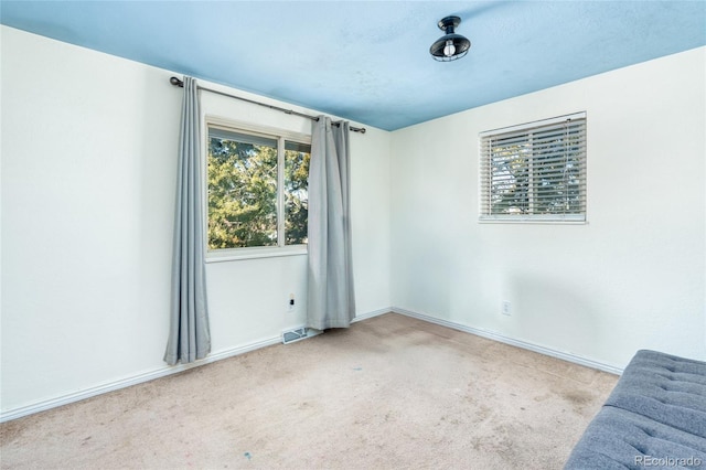 empty room with light colored carpet