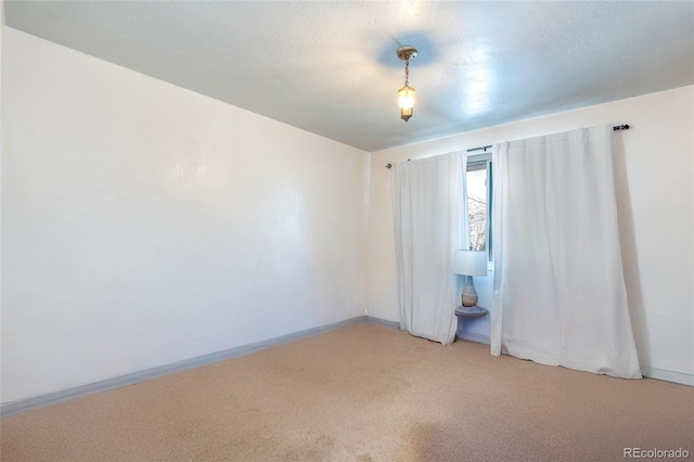 spare room featuring carpet flooring