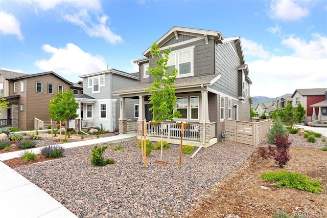 8057 Monte Vista Cir, Littleton, CO 80125 - craftsman inspired home with a residential view, a porch, and board and batten siding