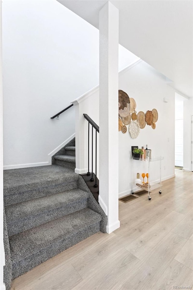 8057 Monte Vista Cir, Littleton, CO 80125 - stairs with wood finished floors and baseboards