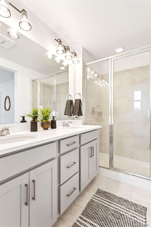 8057 Monte Vista Cir, Littleton, CO 80125 - full bathroom featuring double vanity, a stall shower, and tile patterned flooring