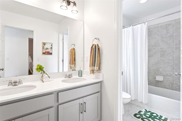 8057 Monte Vista Cir, Littleton, CO 80125 - full bathroom featuring double vanity, toilet, shower / bathtub combination with curtain, and tile patterned flooring
