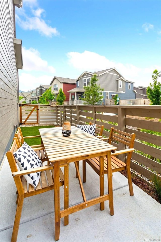 8057 Monte Vista Cir, Littleton, CO 80125 - balcony featuring a residential view and outdoor dining area