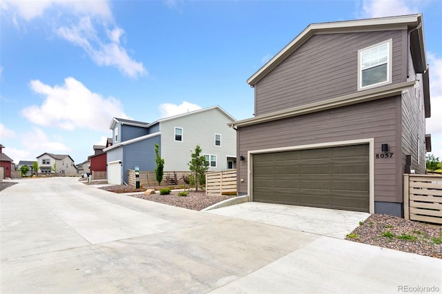 8057 Monte Vista Cir, Littleton, CO 80125 - view of front of house with a garage, driveway, and a residential view