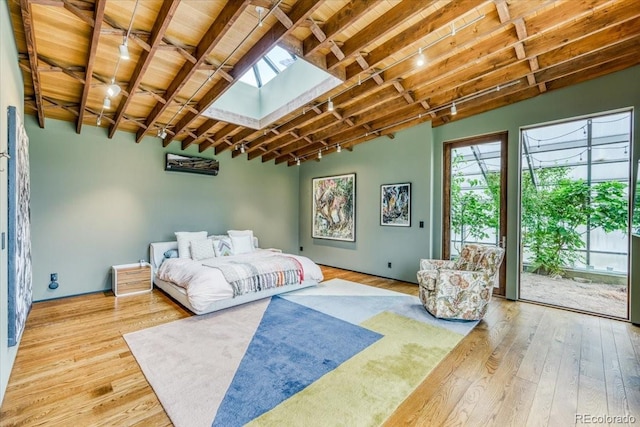 421 Z Rd, Silverthorne, CO 80498 - bedroom featuring access to exterior, hardwood / wood-style floors, a skylight, and a wood ceiling with exposed beams