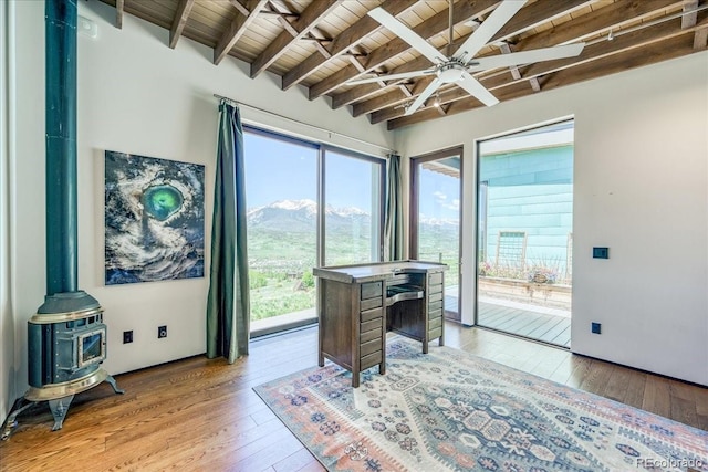 421 Z Rd, Silverthorne, CO 80498 - office space with a wood ceiling with exposed beams, ceiling fan, healthy amount of natural light, hardwood / wood-style floors, and a wood stove