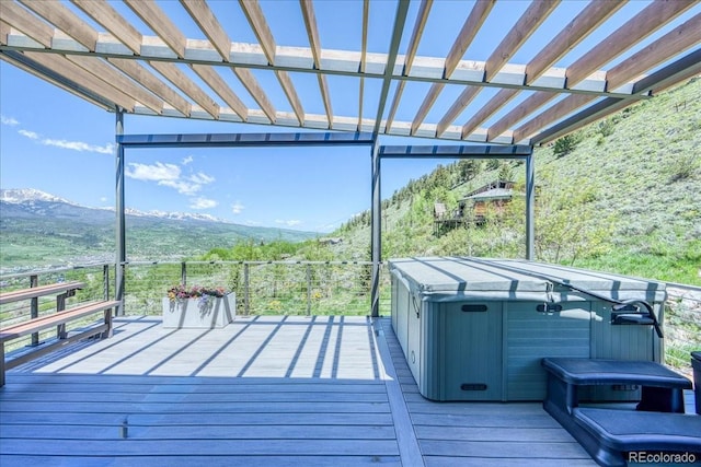421 Z Rd, Silverthorne, CO 80498 - wooden deck with a hot tub, a pergola, and a mountain view