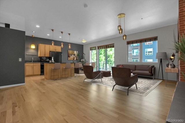 1438 Little Raven St Unit 201, Denver, CO 80202 - living room featuring light wood-style floors and recessed lighting