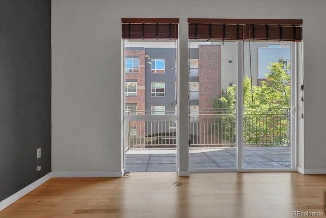 1438 Little Raven St Unit 201, Denver, CO 80202 - entryway featuring wood finished floors and plenty of natural light