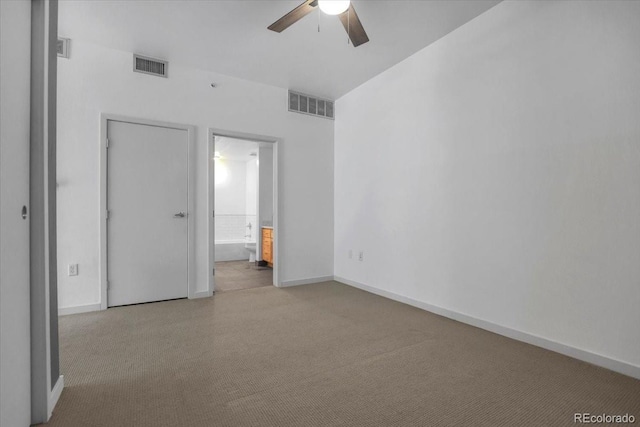 1438 Little Raven St Unit 201, Denver, CO 80202 - unfurnished bedroom featuring connected bathroom, carpet, and a ceiling fan