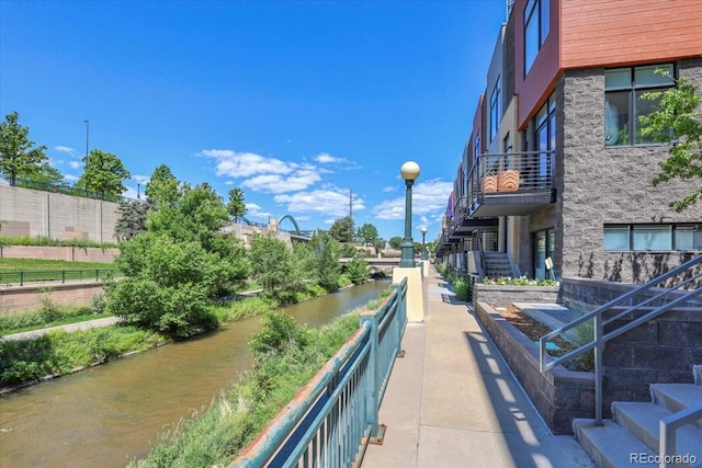 1438 Little Raven St Unit 201, Denver, CO 80202 - balcony with stairway and a water view