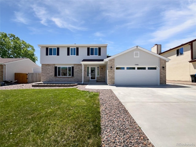 5480 W 74th Ave, Arvada, CO 80003 - view of front of house with a garage, concrete driveway, and brick siding