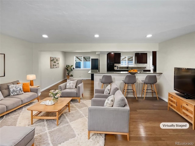 5480 W 74th Ave, Arvada, CO 80003 - living area featuring baseboards, light wood finished floors, and recessed lighting