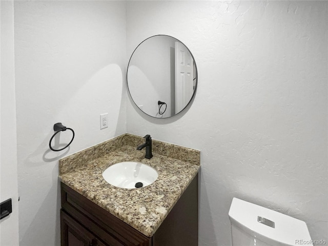 5480 W 74th Ave, Arvada, CO 80003 - half bathroom with vanity and toilet
