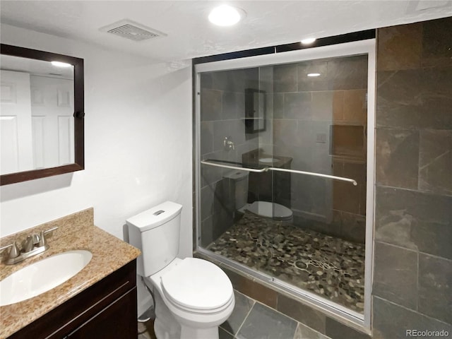 5480 W 74th Ave, Arvada, CO 80003 - full bathroom with toilet, vanity, and a shower stall