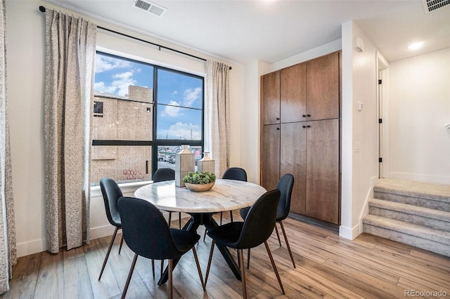 dining room with light wood-type flooring