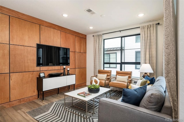 living room with light hardwood / wood-style flooring and a wealth of natural light