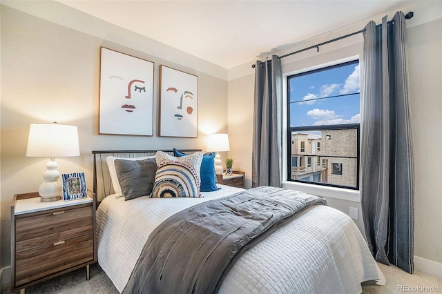 bedroom with light colored carpet