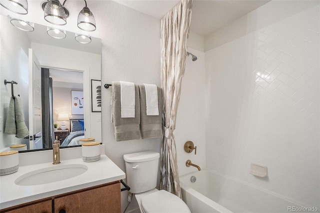 full bathroom featuring vanity, toilet, and shower / tub combo