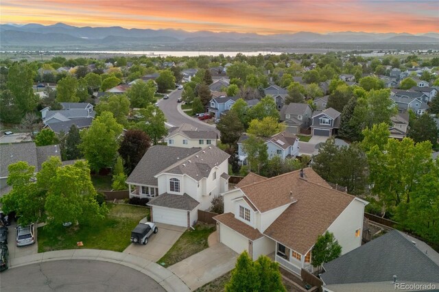 3087 Deer Creek Trl, Highlands Ranch, CO 80129 - aerial view at dusk of a mountain view and a residential view