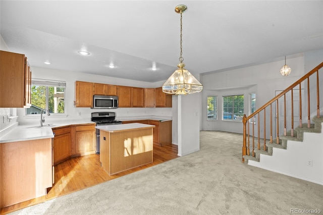 3087 Deer Creek Trl, Highlands Ranch, CO 80129 - kitchen with stainless steel appliances, a center island, healthy amount of natural light, light carpet, and recessed lighting