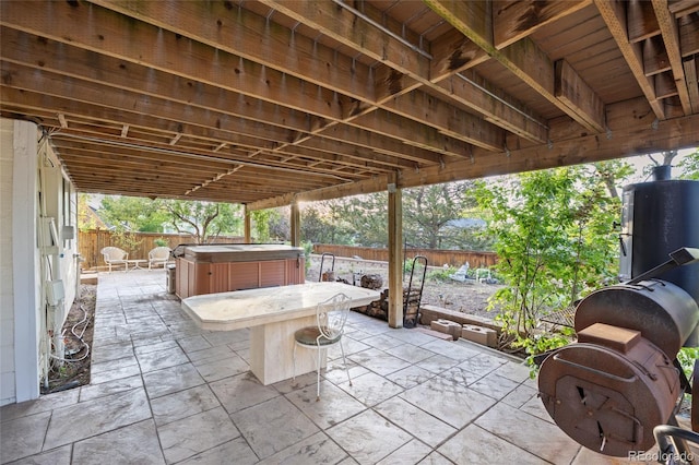 3087 Deer Creek Trl, Highlands Ranch, CO 80129 - fenced backyard featuring a hot tub, a patio, and outdoor dining area