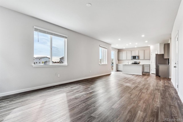 14440 Ranch St, Mead, CO 80504 - unfurnished living room featuring dark wood finished floors and recessed lighting