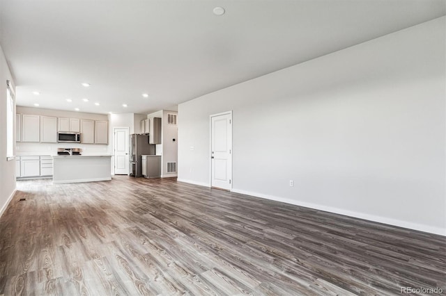 14440 Ranch St, Mead, CO 80504 - unfurnished living room featuring wood finished floors and recessed lighting