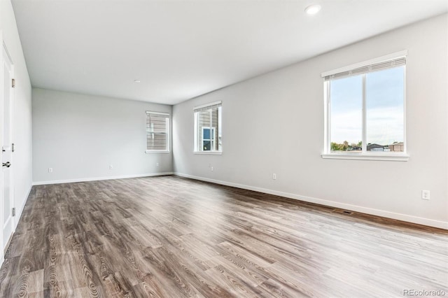 14440 Ranch St, Mead, CO 80504 - spare room featuring plenty of natural light, wood finished floors, and recessed lighting